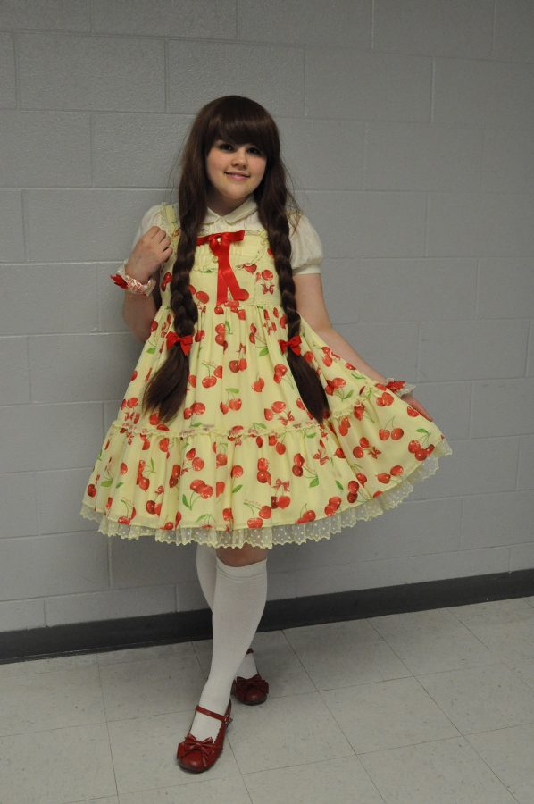 Candice poses for the photo. Candice is easily spotted in the hallway by her interesting dresses.